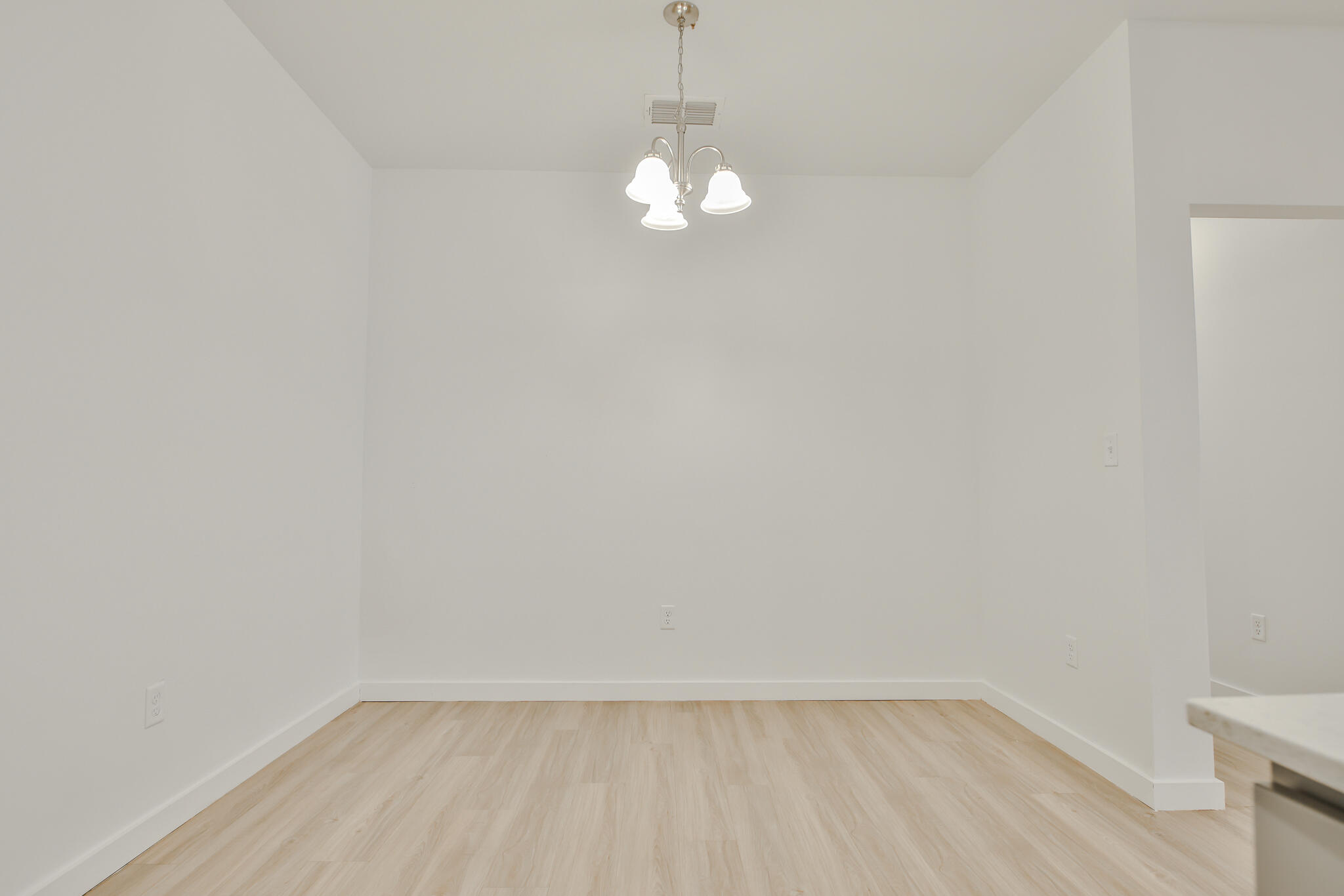 5506 Itasca Street Lubbock, TX 79416 - Photo 6 of 15 a view of empty room with wooden floor and fan