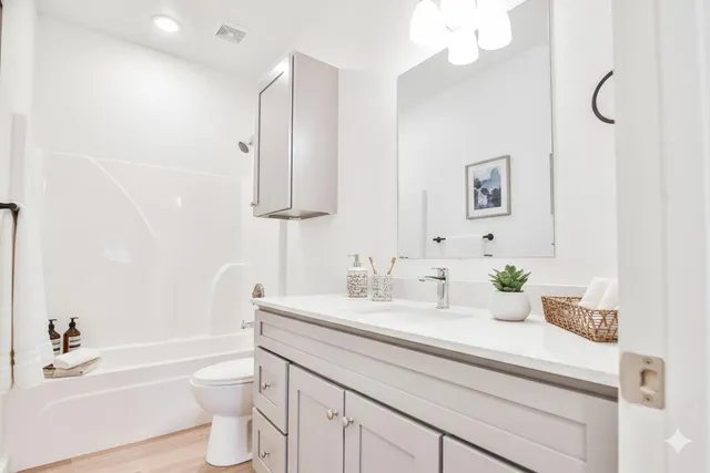 a bathroom with a sink a toilet and a bathtub