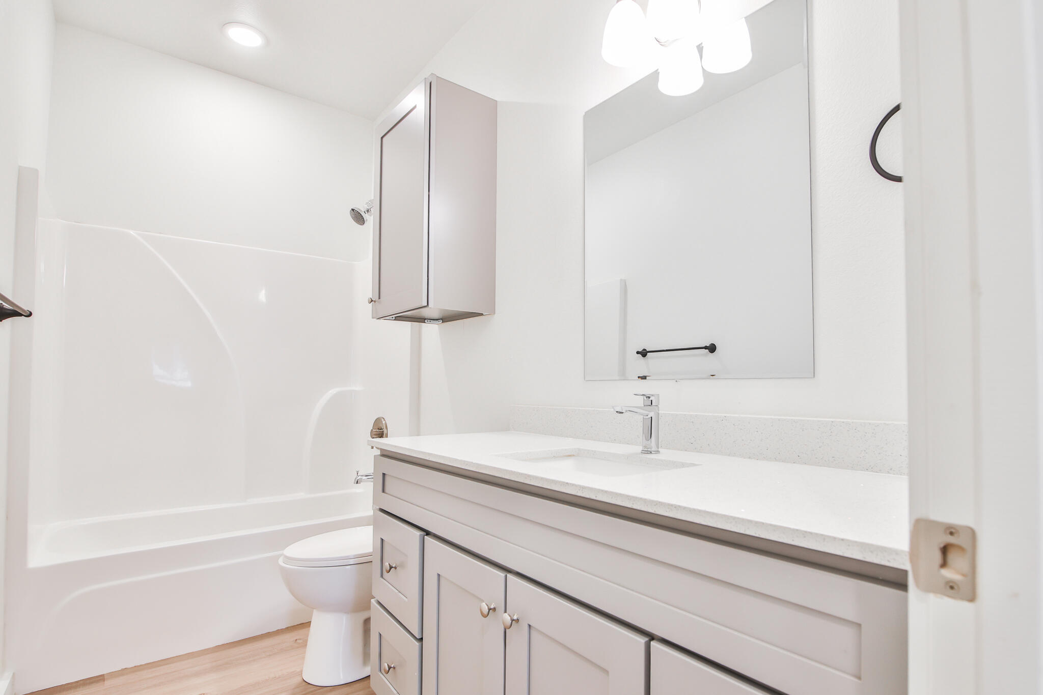 5506 Itasca Street Lubbock, TX 79416 - Photo 8 of 15 a bathroom with a sink a toilet and bathtub