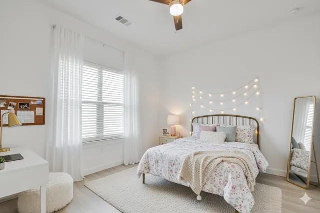 a bedroom with bed and window