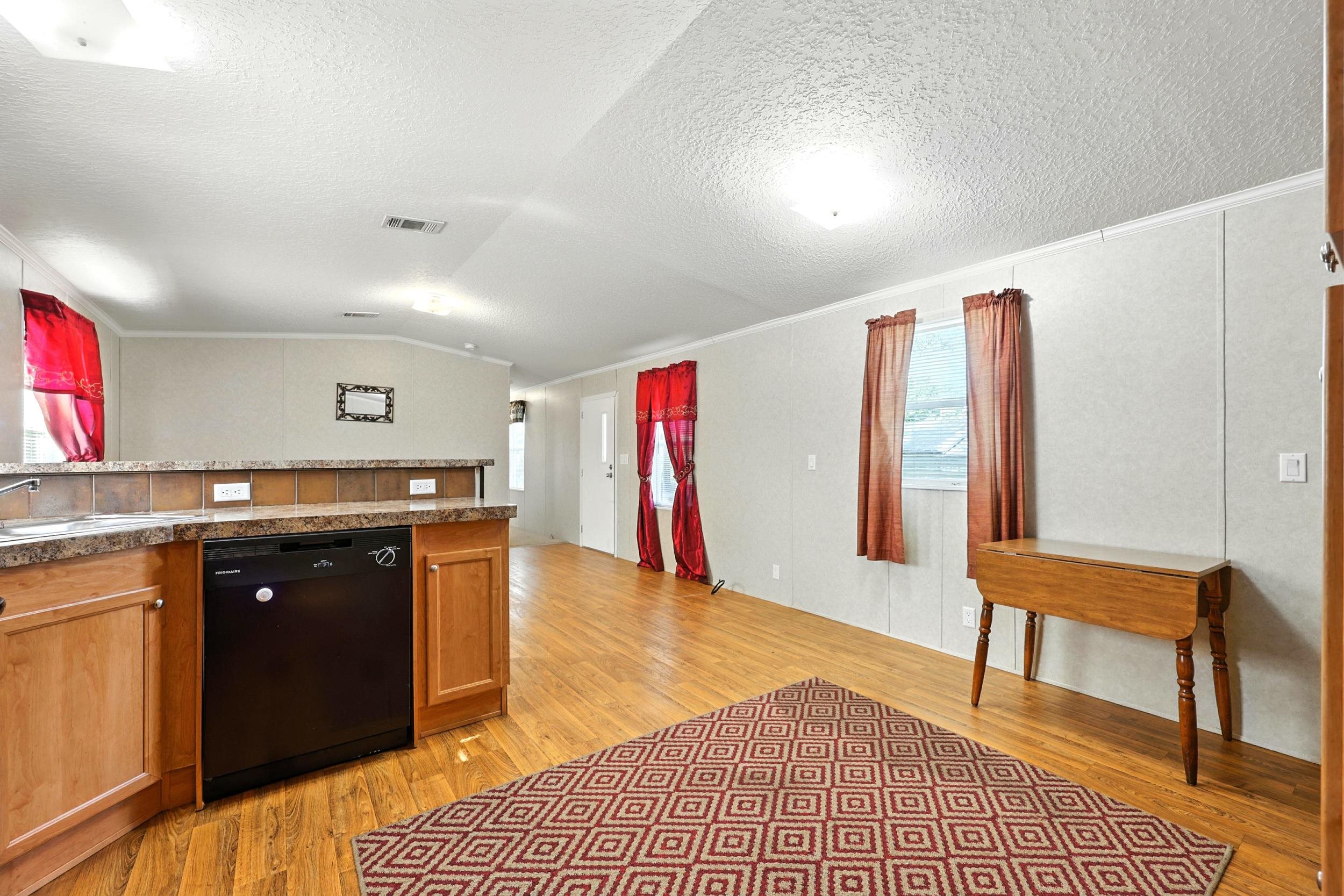 300 East Carter Street Hastings, FL 32145 - Photo 11 of 41 a living room with stainless steel appliances granite countertop furniture a rug and a window