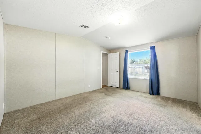 a view of empty room with windows