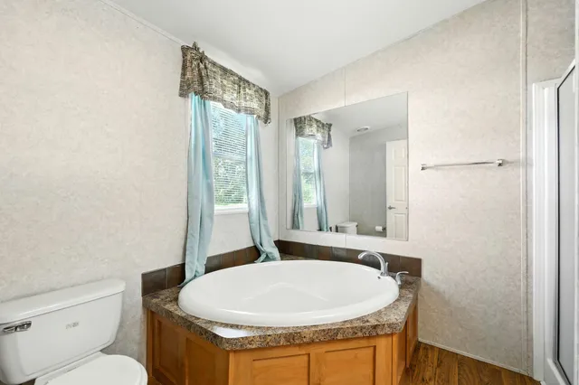 a bathroom with a bathtub and a sink