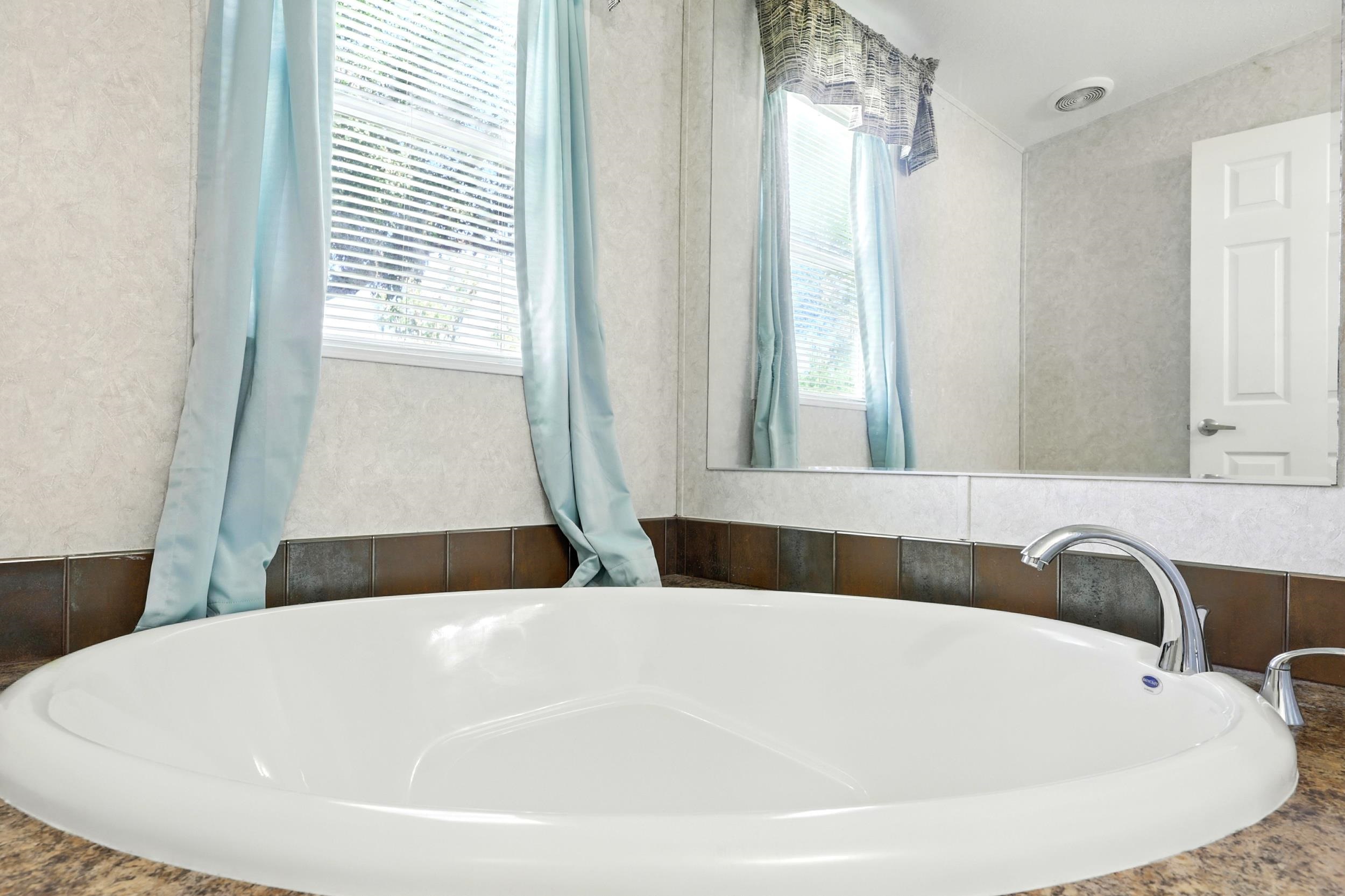 300 East Carter Street Hastings, FL 32145 - Photo 20 of 41 a bathroom with a bathtub and a sink