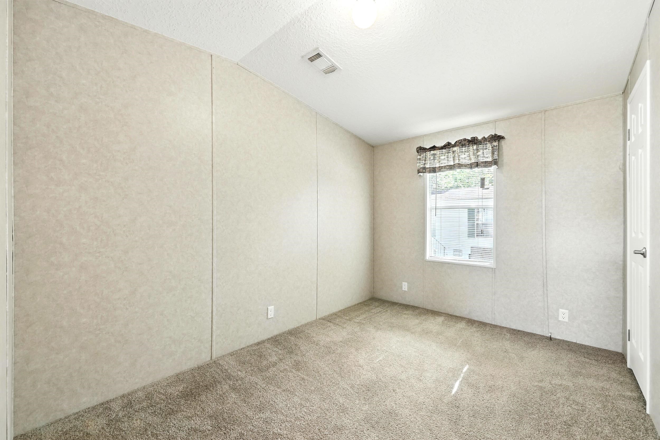 300 East Carter Street Hastings, FL 32145 - Photo 21 of 41 a view of an empty room with a window