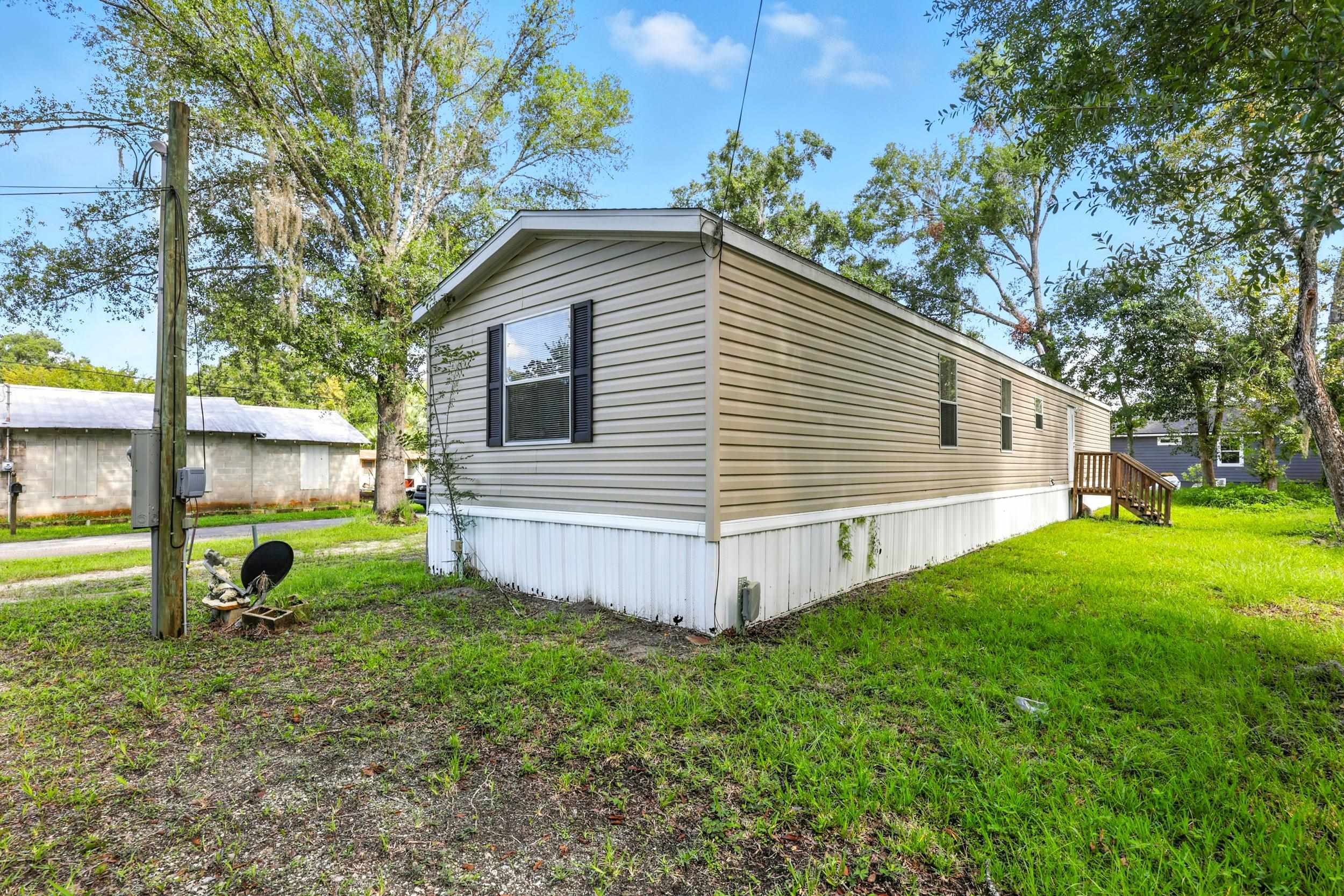300 East Carter Street Hastings, FL 32145 - Photo 26 of 41 a view of a house with a yard