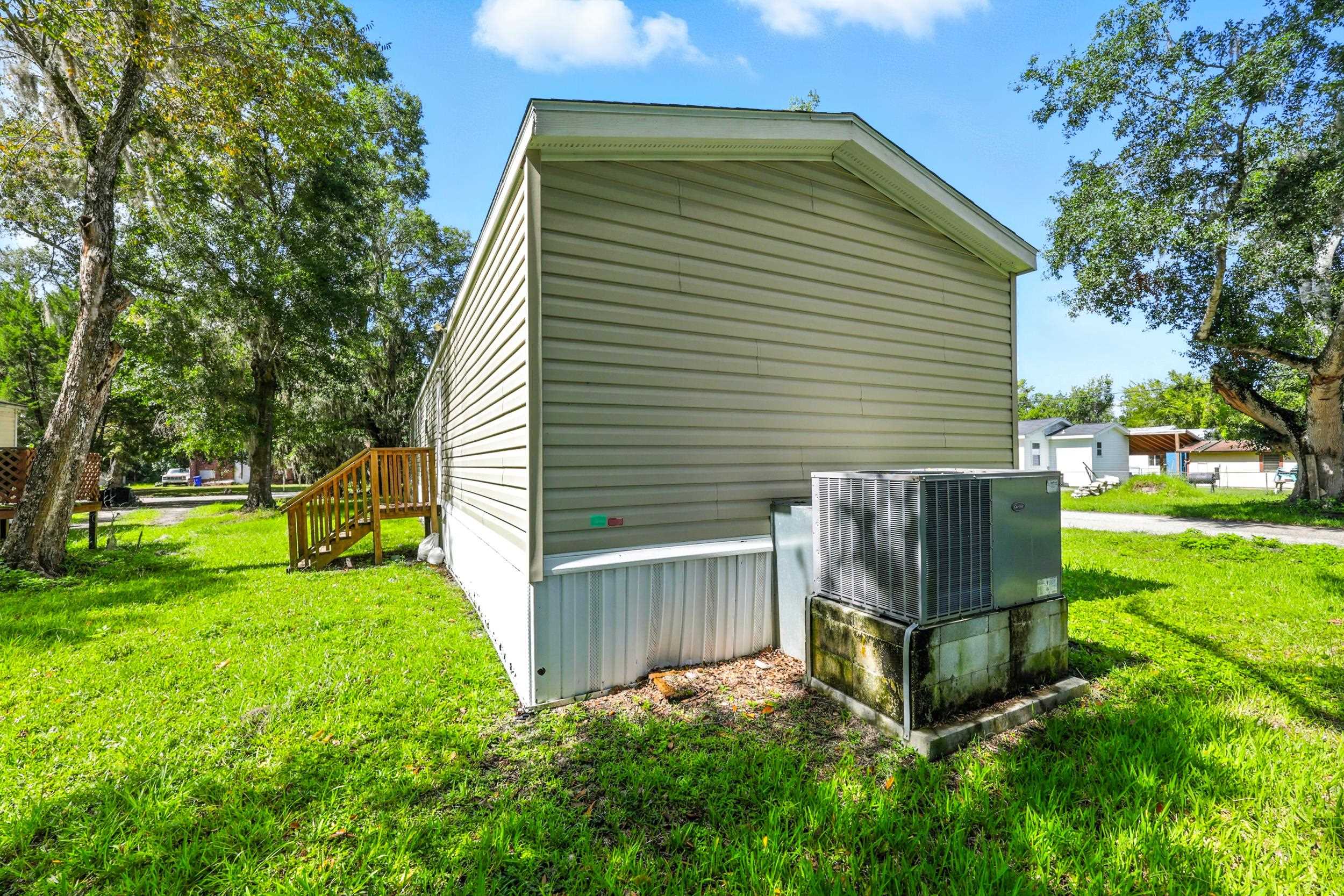 300 East Carter Street Hastings, FL 32145 - Photo 27 of 41 a view of a backyard with a garden
