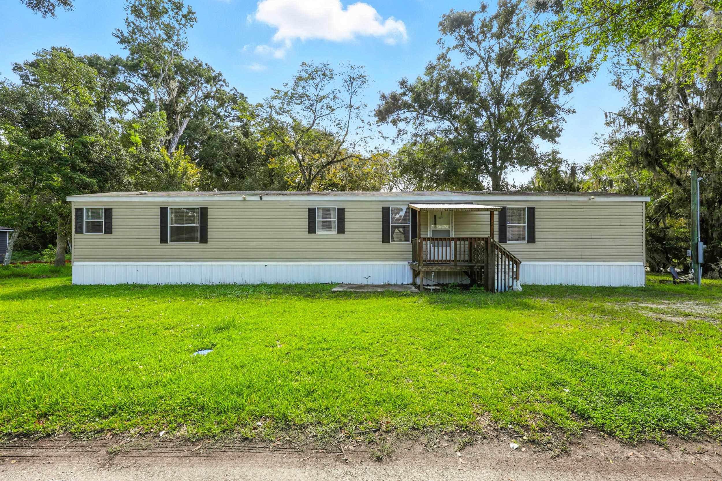 300 East Carter Street Hastings, FL 32145 - Photo 29 of 41 a backyard of a house with seating space