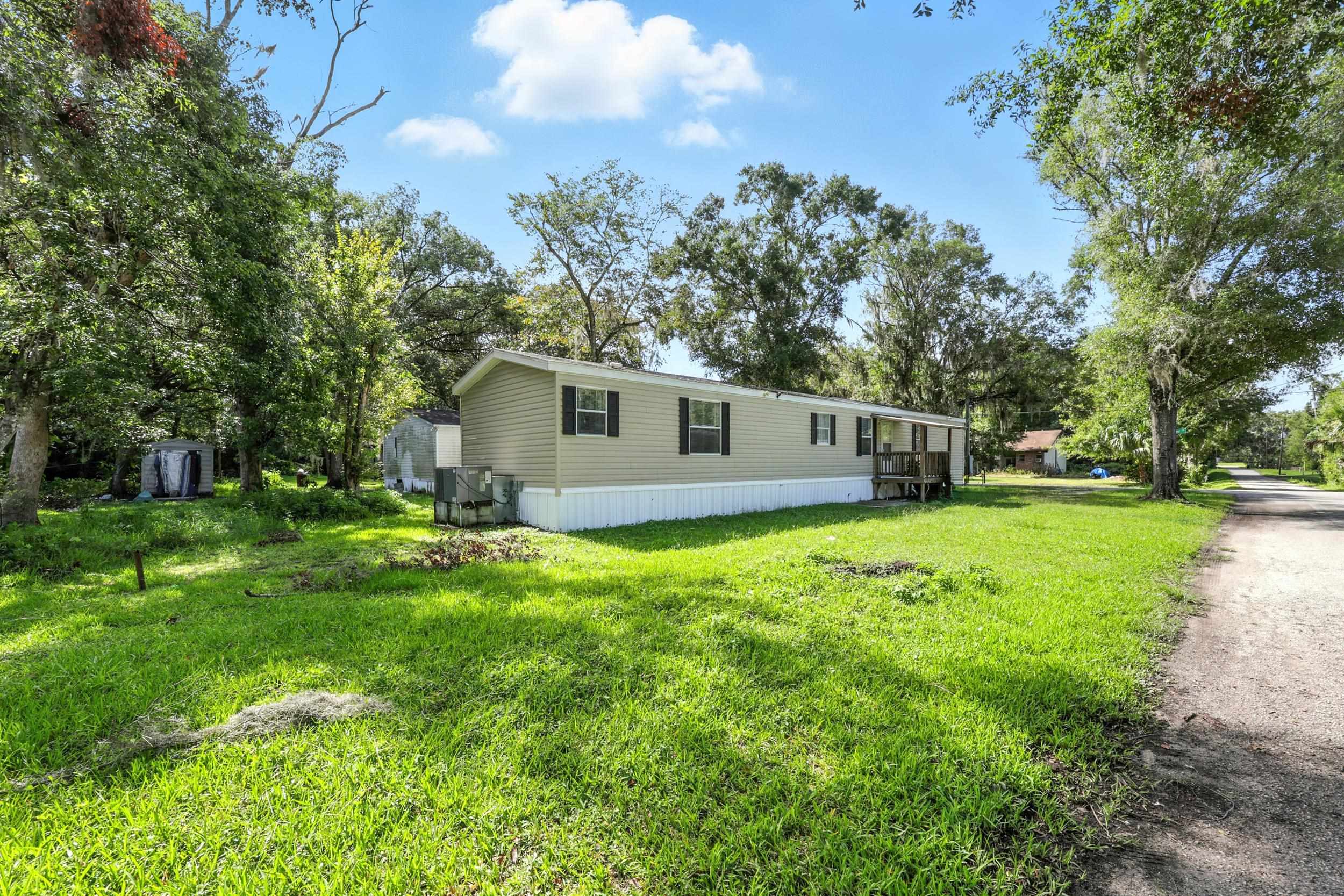 300 East Carter Street Hastings, FL 32145 - Photo 30 of 41 a view of a house with backyard