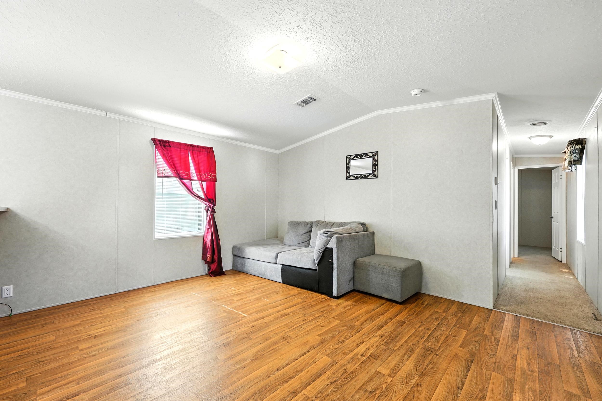 300 East Carter Street Hastings, FL 32145 - Photo 8 of 41 a bedroom with furniture and a window