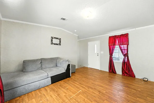 a kitchen with granite countertop stainless steel appliances a refrigerator and a stove top oven