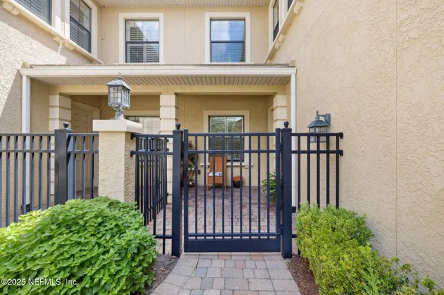 a kitchen with stainless steel appliances granite countertop a stove microwave and sink