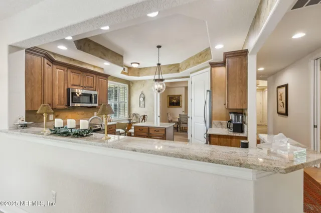 a bathroom with a tub a sink and mirror