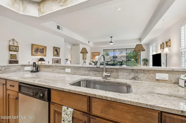 a bedroom with a bed a table and chair