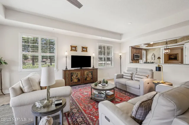 a view of a house with a yard and a fountain