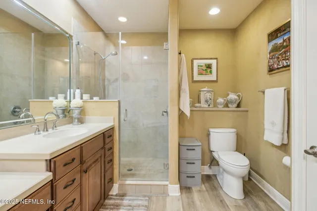 a sign that is sitting in front of flowers