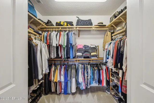 an aerial view of a house with a yard swimming pool and outdoor seating