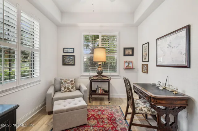 an aerial view of a house with a garden and lake view
