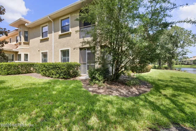 a kitchen with stainless steel appliances granite countertop a sink refrigerator and microwave