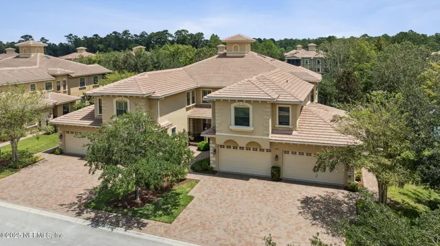 an aerial view of a house with outdoor space
