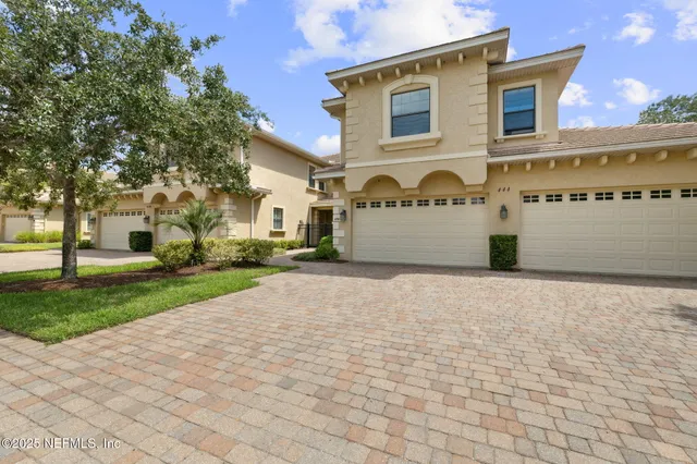 a view of a dining room with furniture and window