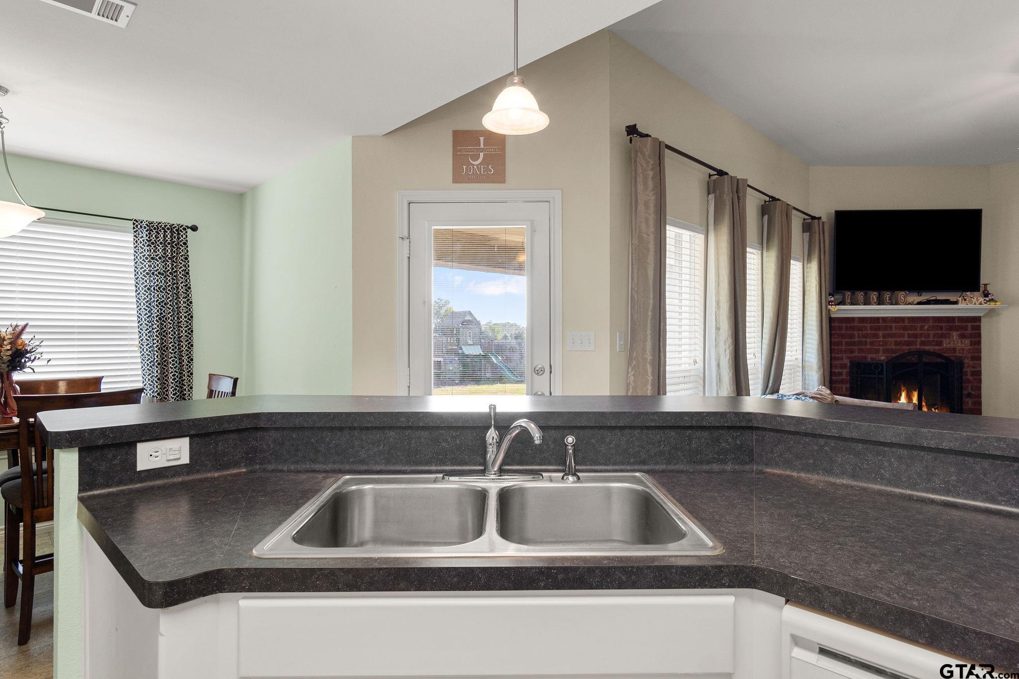 11269 Twin Spires Drive Flint, TX 75762 - Photo 11 of 23 a view kitchen with granite countertop a sink and a window