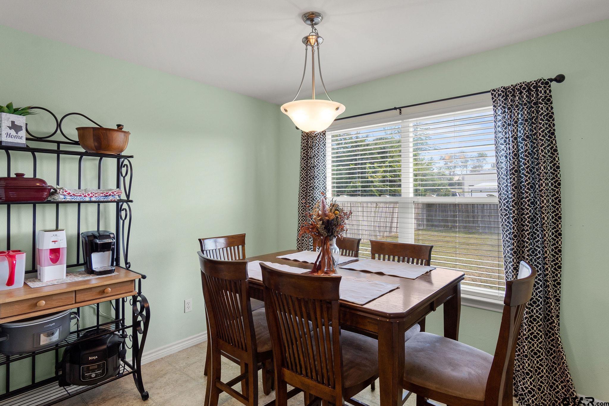 11269 Twin Spires Drive Flint, TX 75762 - Photo 12 of 23 a view of a dining room with furniture window and outside view