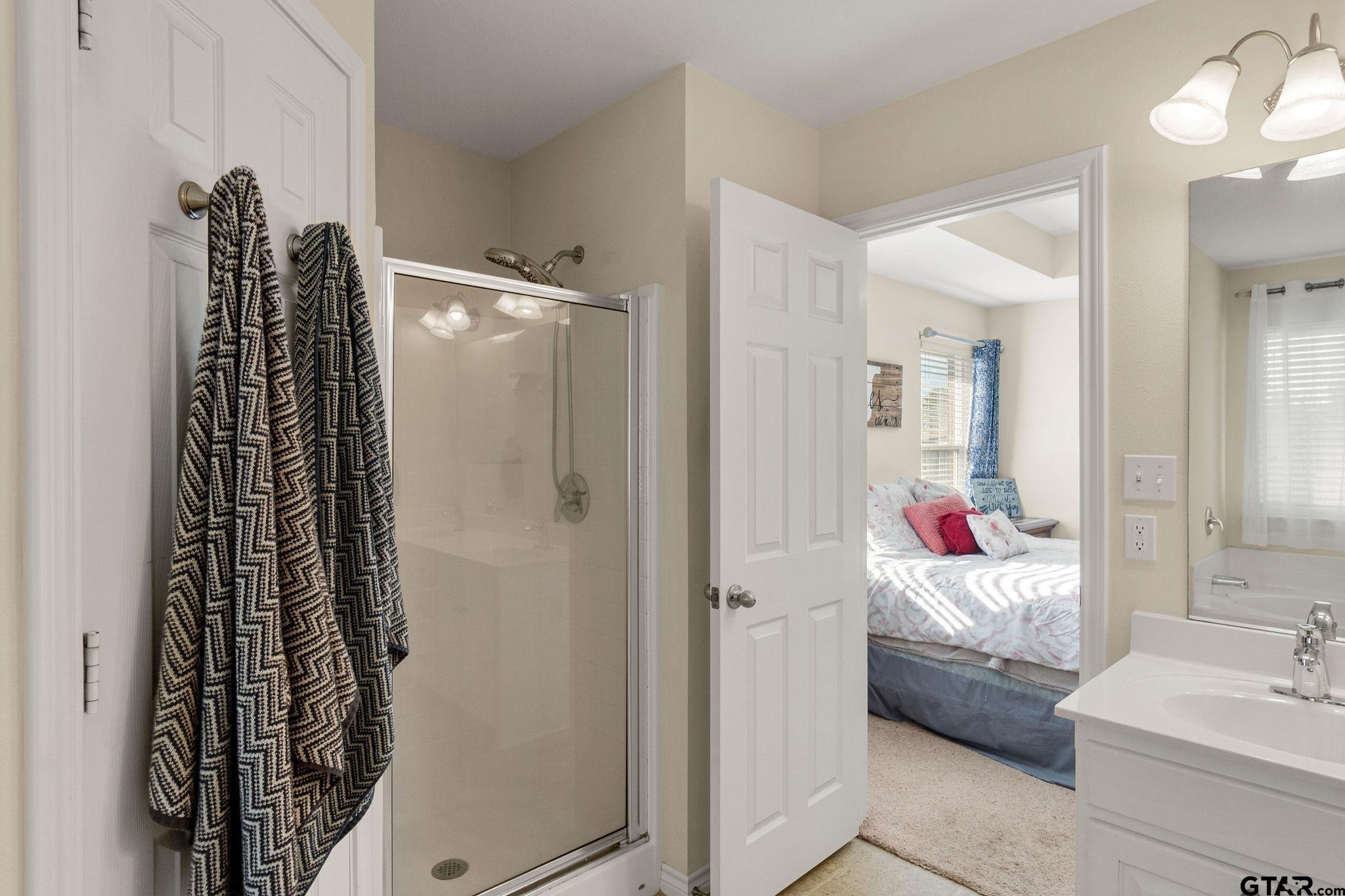 11269 Twin Spires Drive Flint, TX 75762 - Photo 17 of 23 a en suite bathroom with a shower and a sink