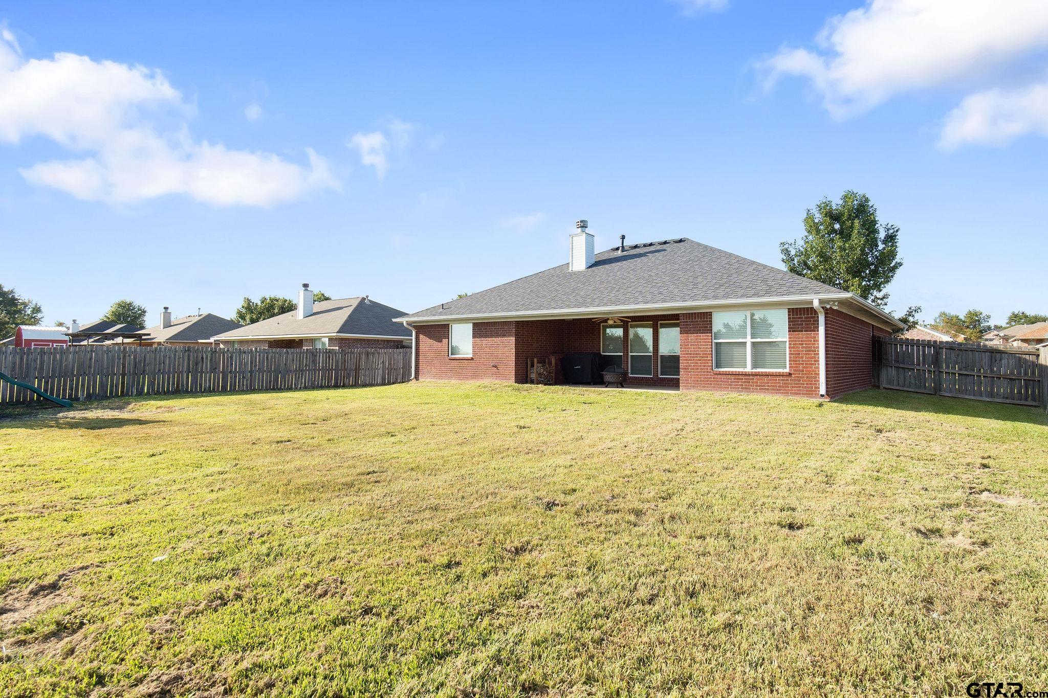 11269 Twin Spires Drive Flint, TX 75762 - Photo 21 of 23 a front view of a house with a yard