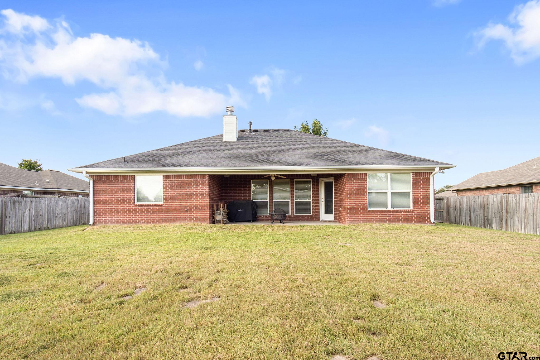 11269 Twin Spires Drive Flint, TX 75762 - Photo 23 of 23 a front view of a house with yard and garage