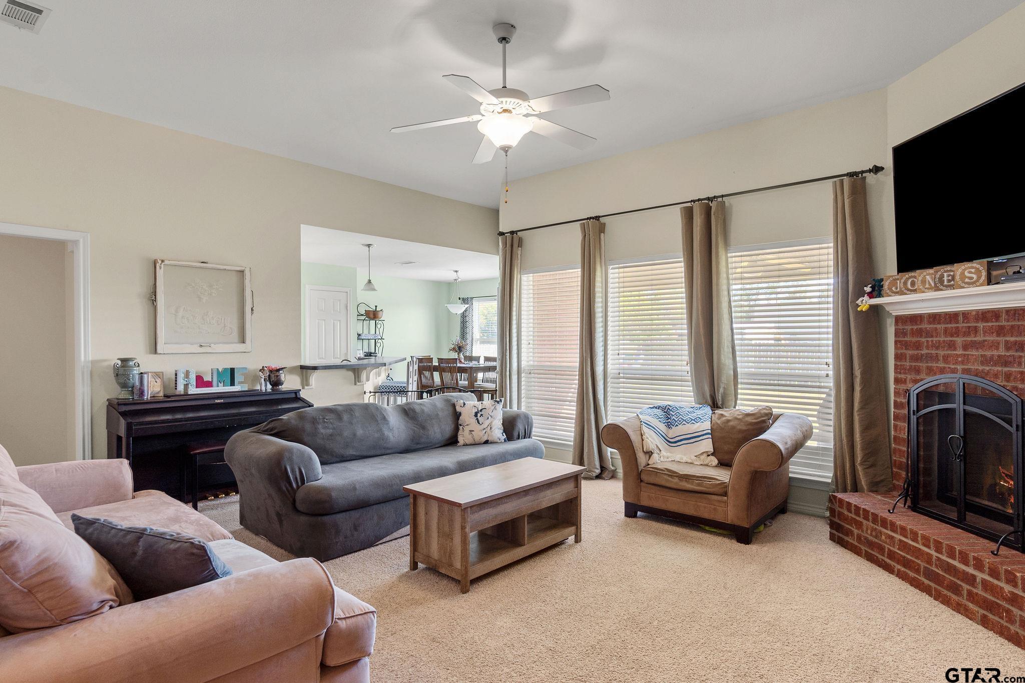11269 Twin Spires Drive Flint, TX 75762 - Photo 3 of 23 a living room with furniture fireplace and flat screen tv
