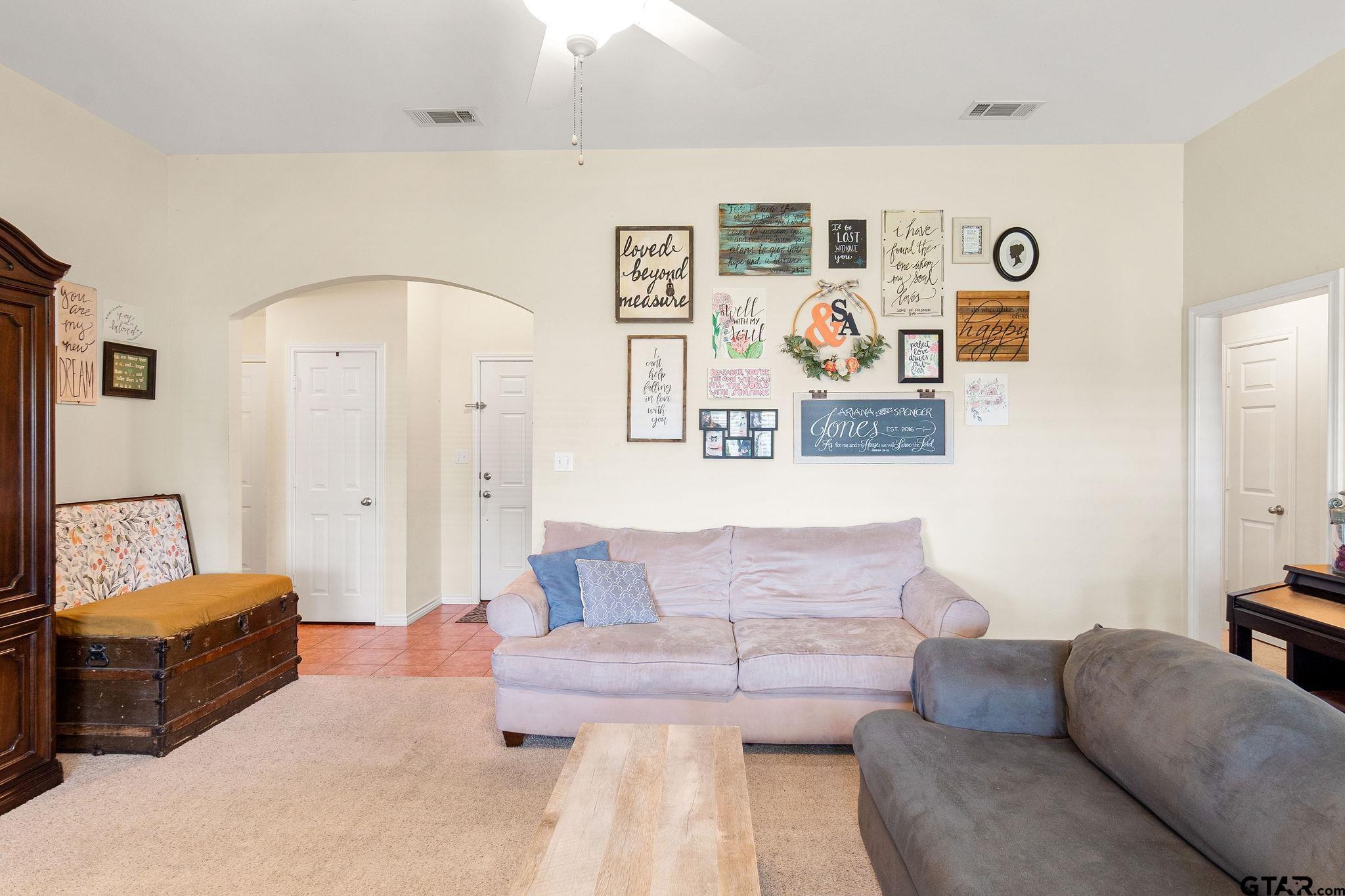 11269 Twin Spires Drive Flint, TX 75762 - Photo 4 of 23 a living room with furniture and painting on the wall