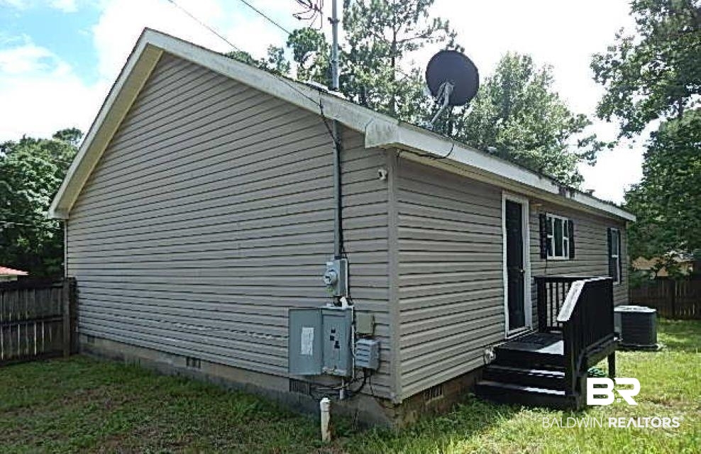 6996 Pinehill Road Daphne, AL 36526 - Photo 3 of 18 View of home's exterior with crawl space and a cooling unit