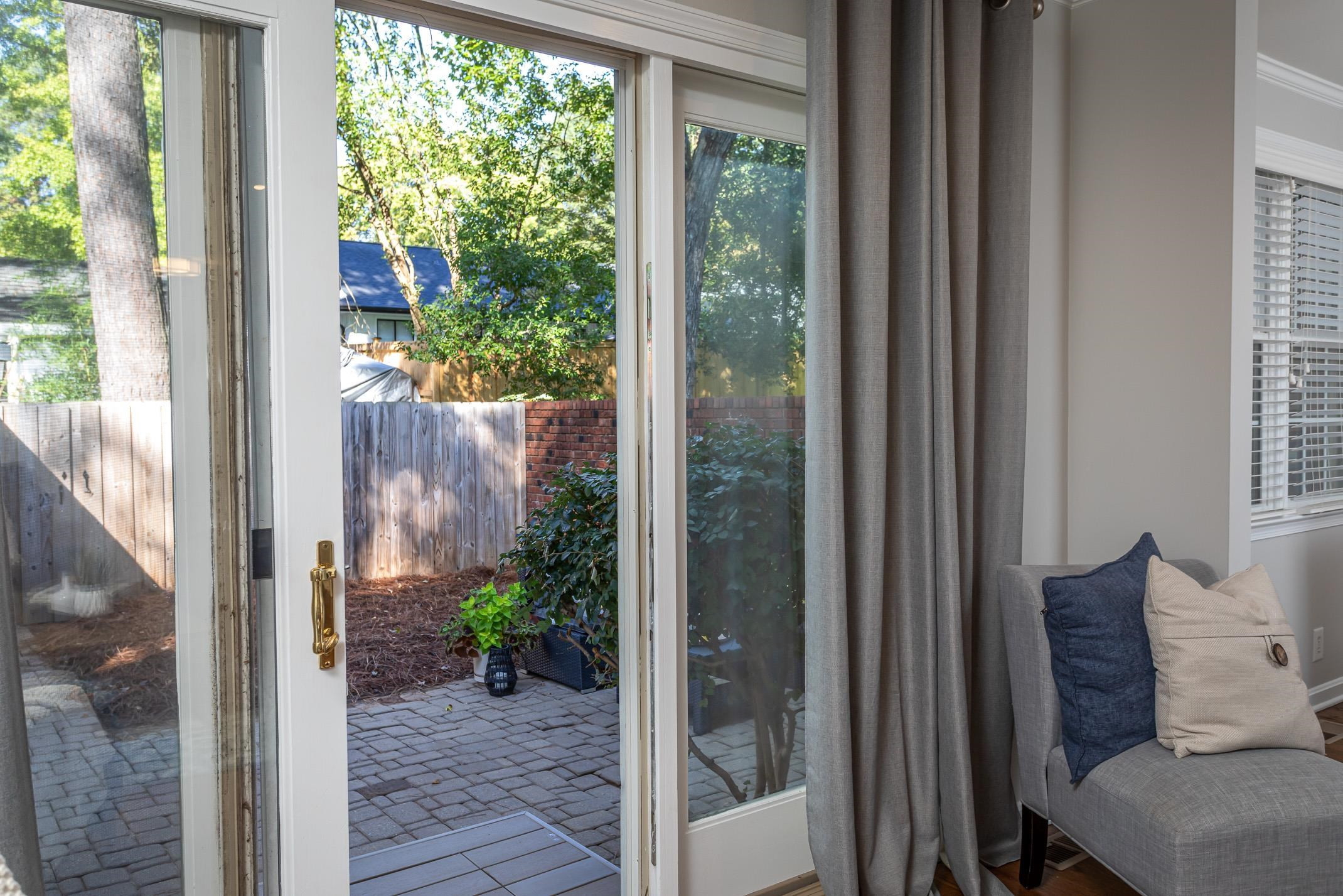 2943 Wycliff Road Raleigh, NC 27607 - Photo 18 of 31 a view of a balcony with a potted plant and a glass door
