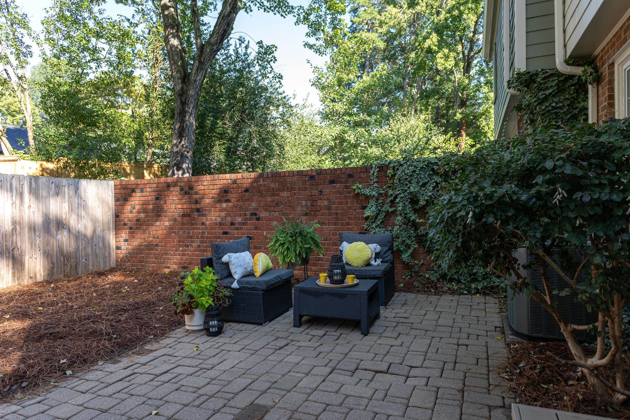 2943 Wycliff Road Raleigh, NC 27607 - Photo 19 of 31 a garden with a table and a chairs