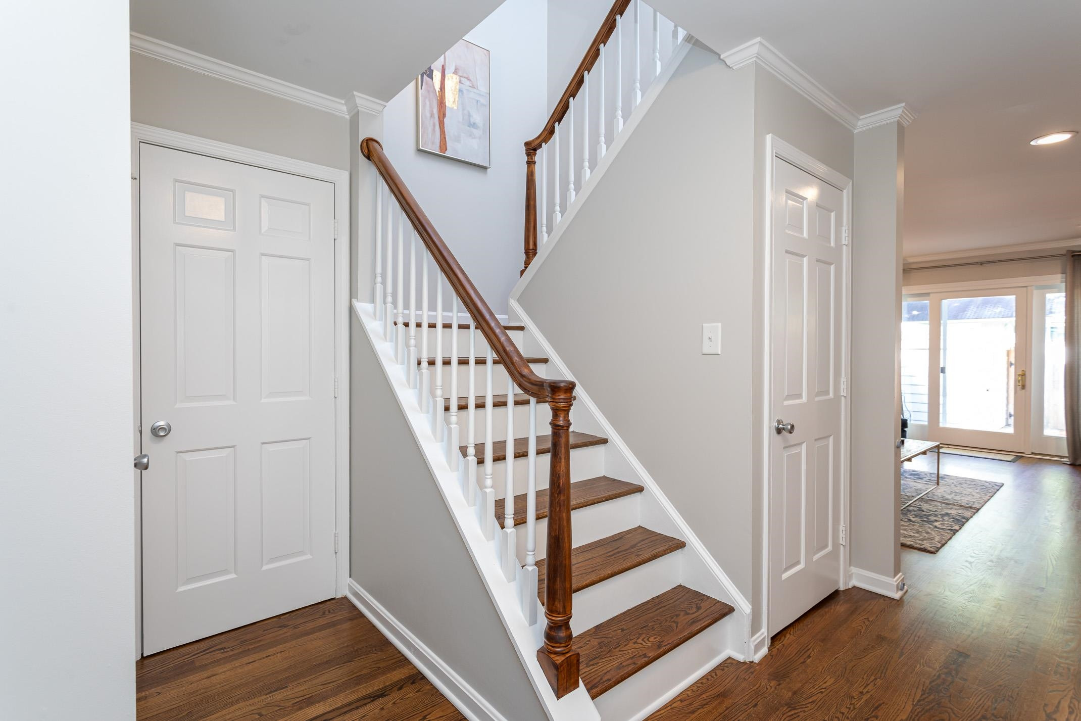 2943 Wycliff Road Raleigh, NC 27607 - Photo 23 of 31 a view of staircase with wooden floor and white walls