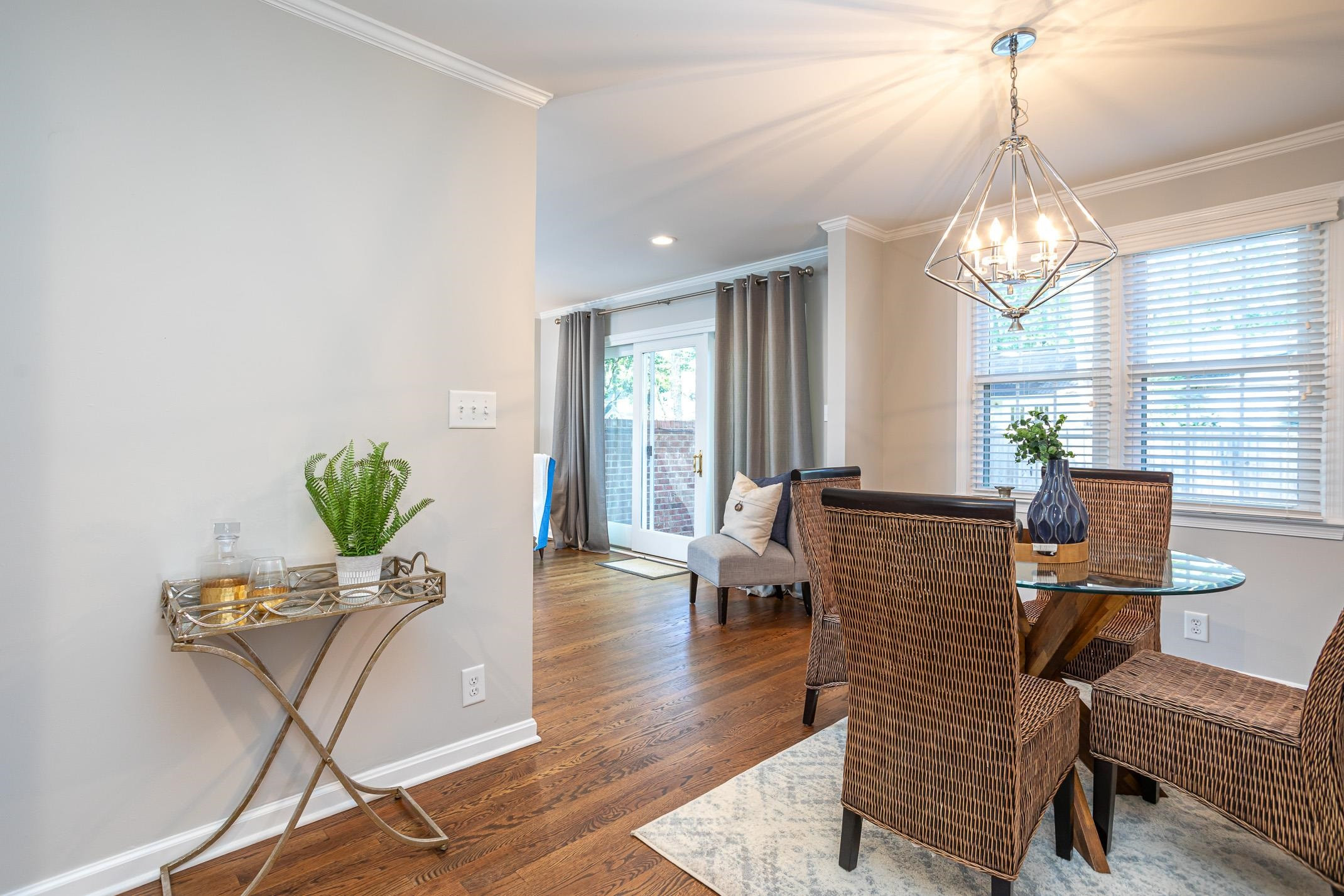 2943 Wycliff Road Raleigh, NC 27607 - Photo 9 of 31 a living room with furniture chandelier and a window