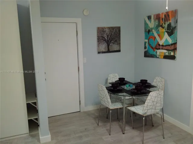 a dining room that has a table and chair
