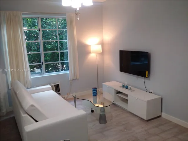 a bathroom with a toilet and a mirror