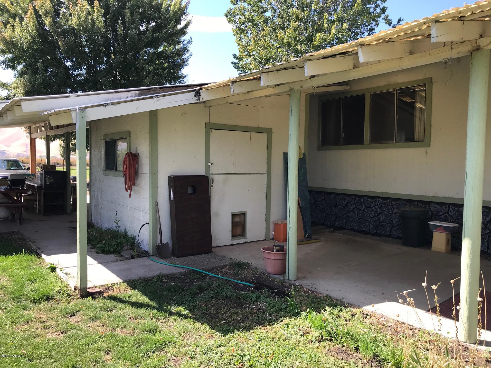 4031 Bell Road Yakima, WA 98901 - Photo 13 of 28 a view of a small house with backyard