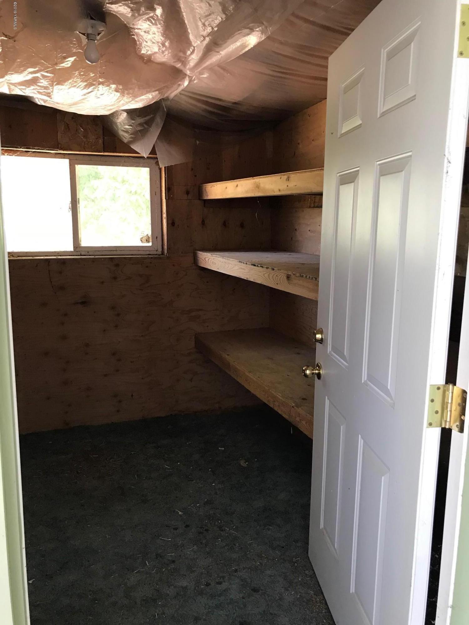 4031 Bell Road Yakima, WA 98901 - Photo 22 of 28 a view of room with window and ceiling fan