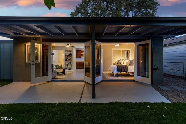a patio with table and chairs