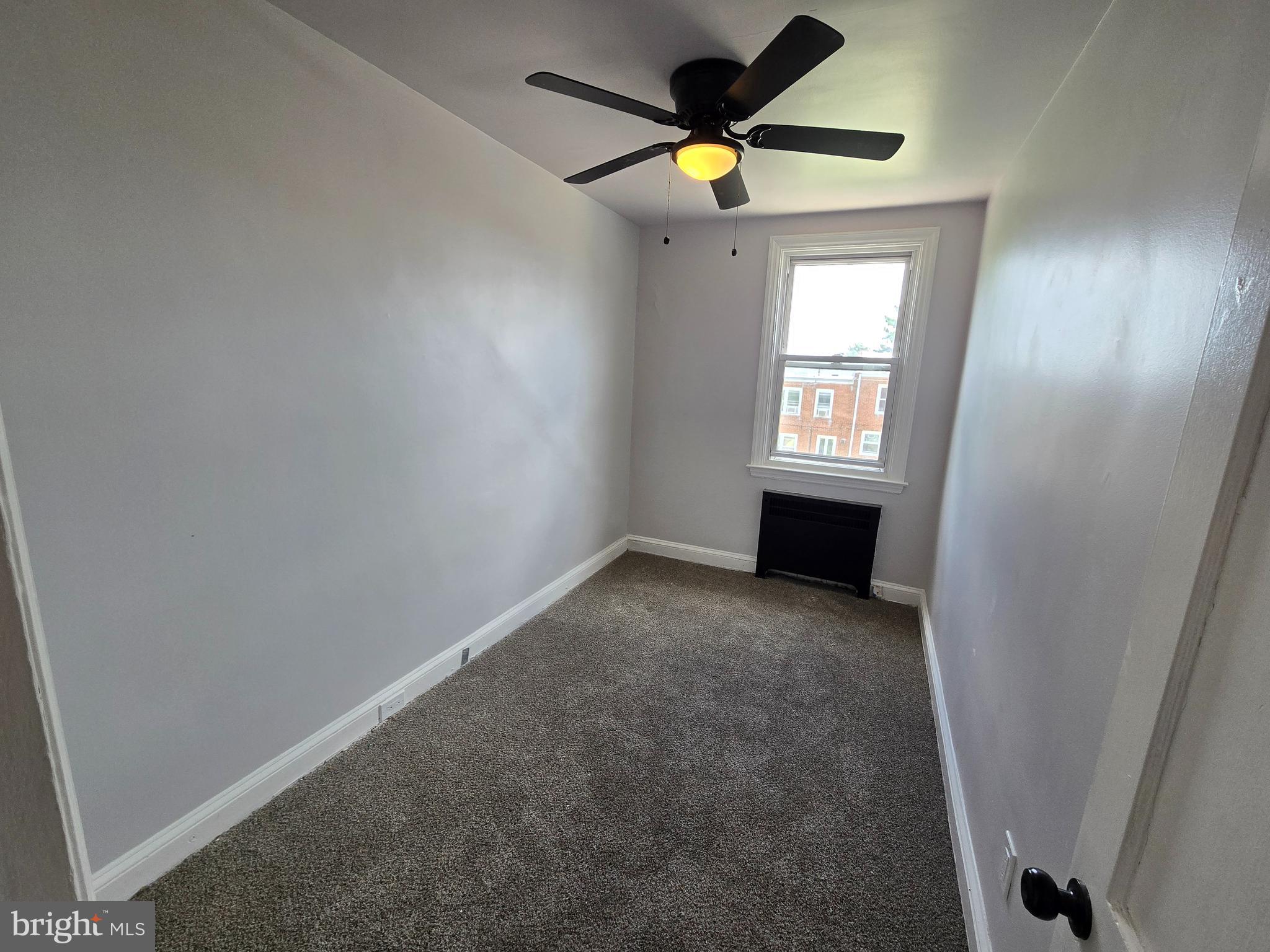 201 St Laurence Road Upper Darby, PA 19082 - Photo 33 of 37 an empty room with a window and a fan