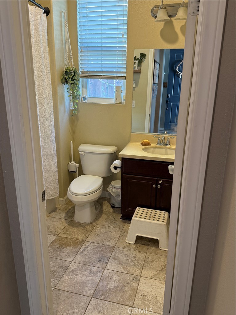 30130 Pine Needle Road Menifee, CA 92585 - Photo 12 of 45 a bathroom with a sink and a toilet