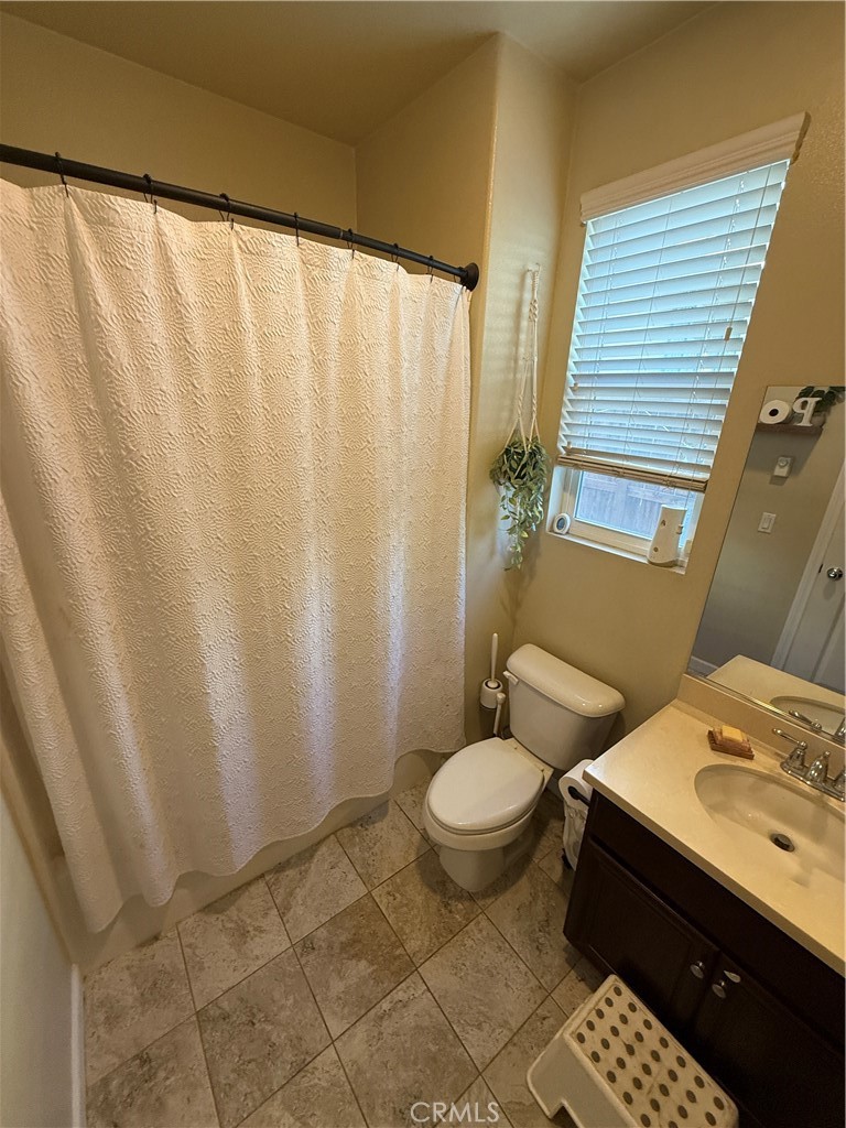 30130 Pine Needle Road Menifee, CA 92585 - Photo 14 of 45 a bathroom with a sink toilet and shower