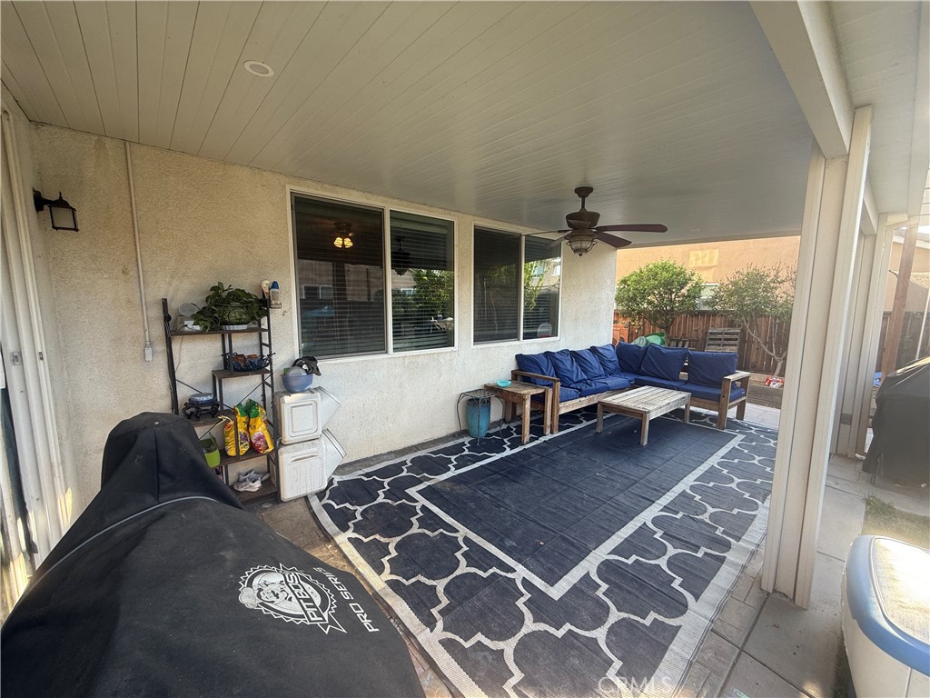 30130 Pine Needle Road Menifee, CA 92585 - Photo 44 of 45 a living room with furniture and a table