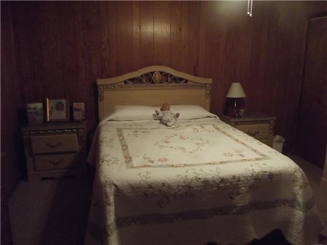896 Solomon Road Pulaski, TN 38478 - Photo 10 of 20 a bedroom with a bed and a cabinets