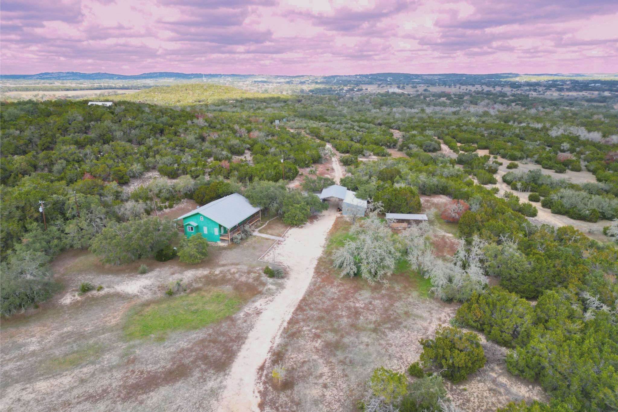 Aerial view at dusk of a wooded view