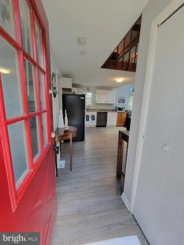 a view of a living room with furniture and a fireplace