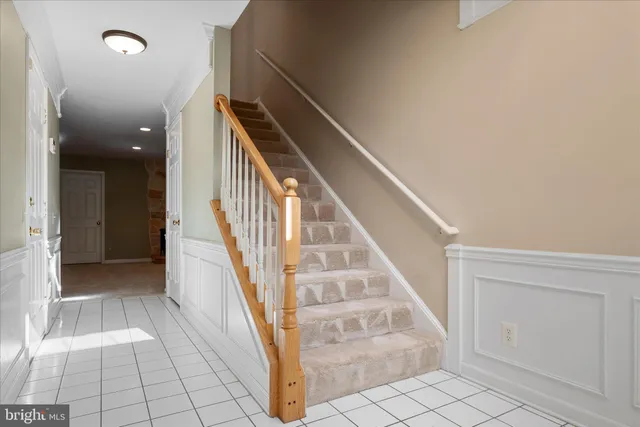 a view of a room with furniture and wooden floor
